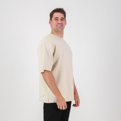 Stillknocks Ivory Boxy Tee: Soft Cotton, Relaxed Drop-Shoulder Fit, Tonal Logo