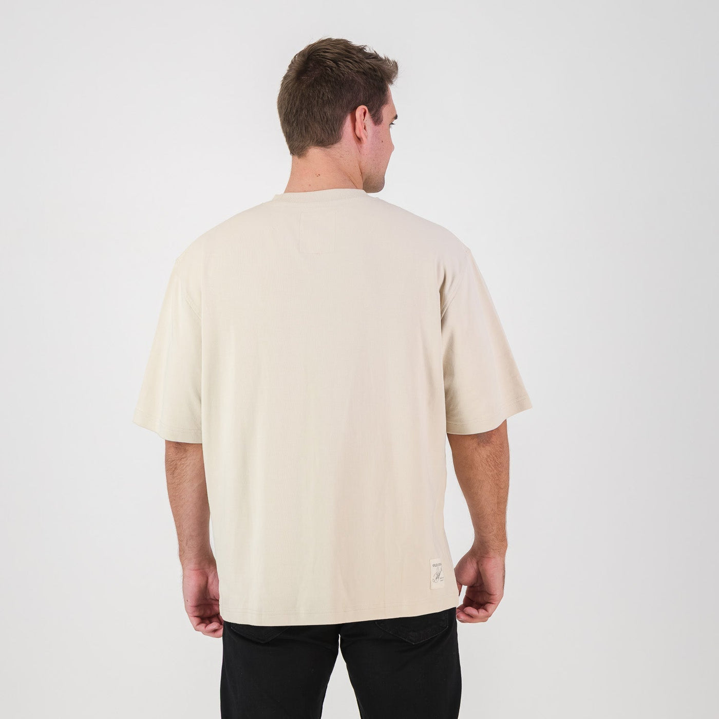 Stillknocks Ivory Boxy Tee: Soft Cotton, Relaxed Drop-Shoulder Fit, Tonal Logo
