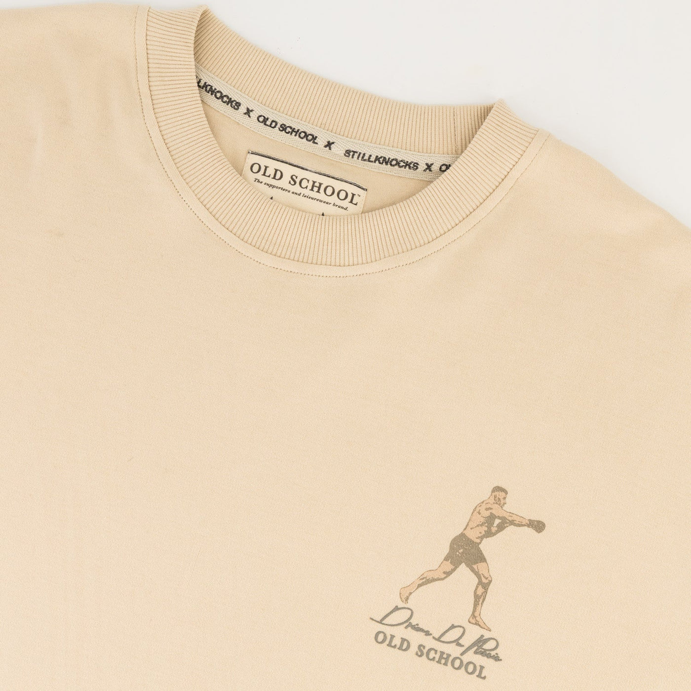 Stillknocks Ivory Boxy Tee: Soft Cotton, Relaxed Drop-Shoulder Fit, Tonal Logo