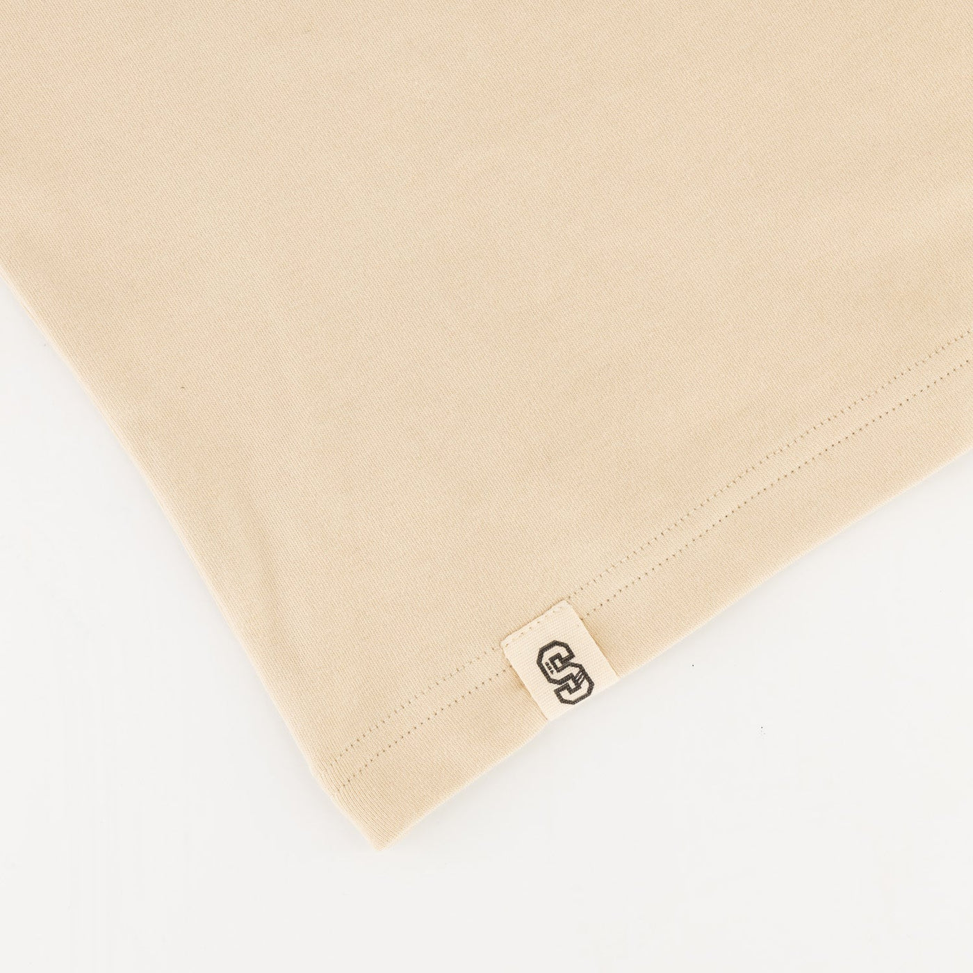 Stillknocks Ivory Boxy Tee: Soft Cotton, Relaxed Drop-Shoulder Fit, Tonal Logo