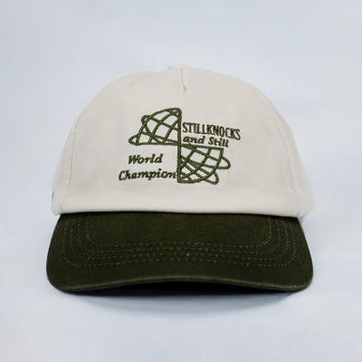 Stillknocks World Champion Two-Tone Dad Cap: Ivory Cotton Twill, Embroidered Globe