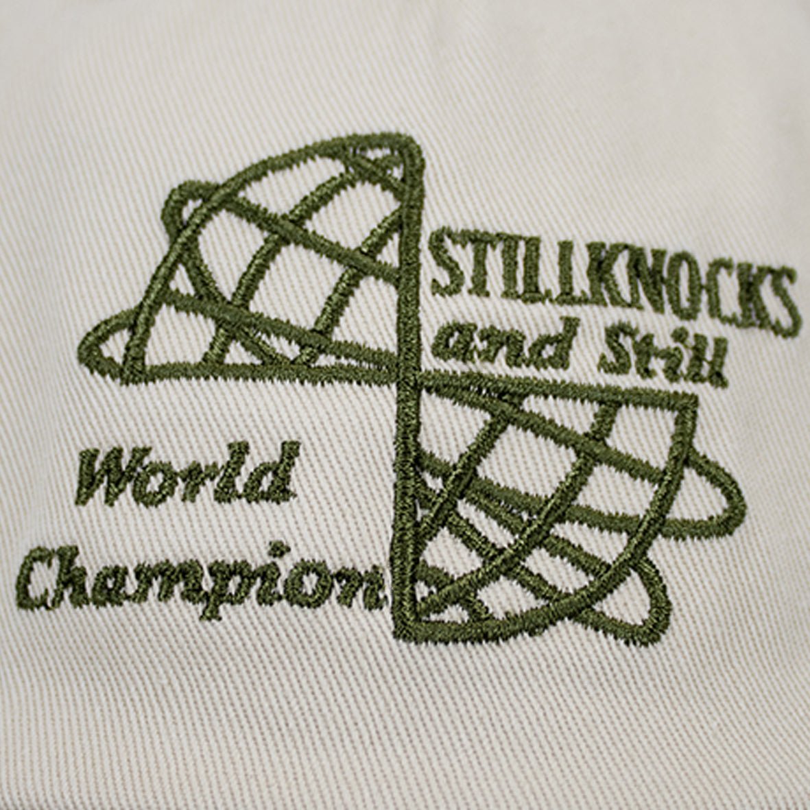 Stillknocks World Champion Two-Tone Dad Cap: Ivory Cotton Twill, Embroidered Globe