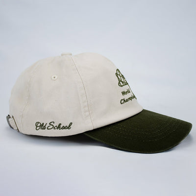 Stillknocks World Champion Two-Tone Dad Cap: Ivory Cotton Twill, Embroidered Globe